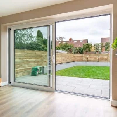 Internal photograph of a white lift and slide patio door installed by alexander windows