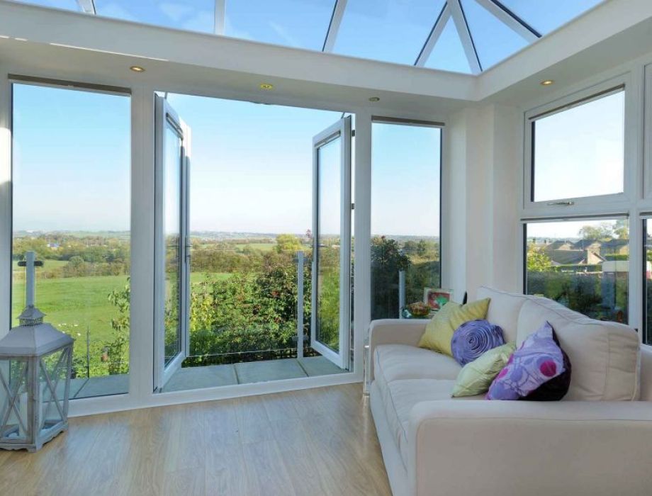 Glass conservatory with open doors	