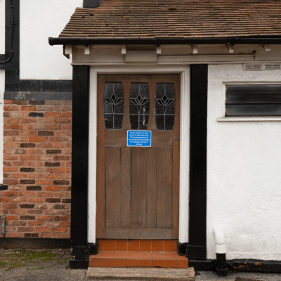 old wooden door at davenport residential home in stockport that was in need of replacement