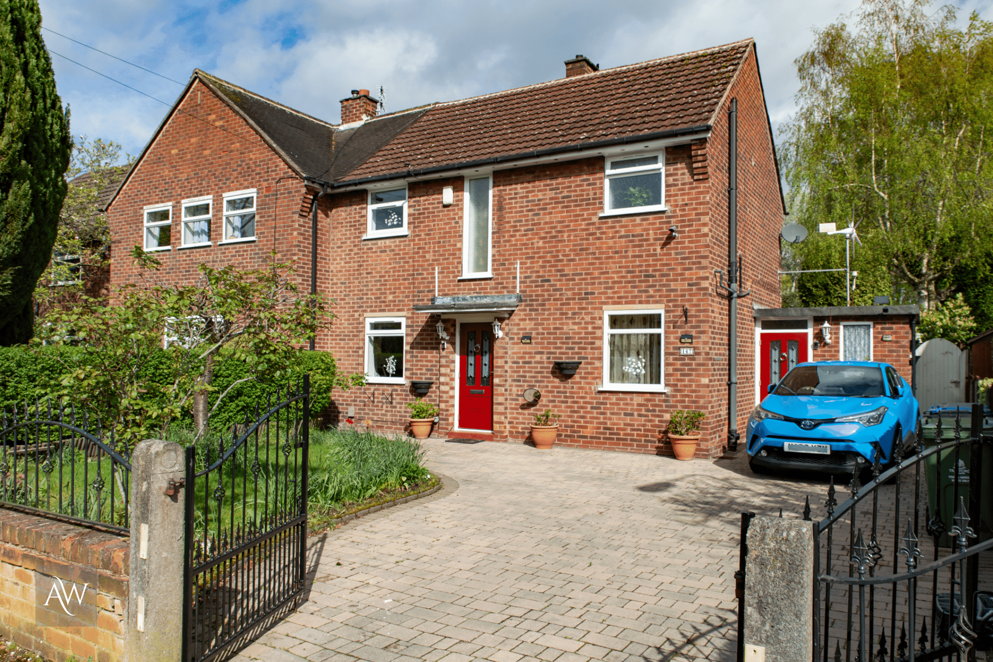 two rockdoor illinois composite doors in ruby red installed at a property in sale