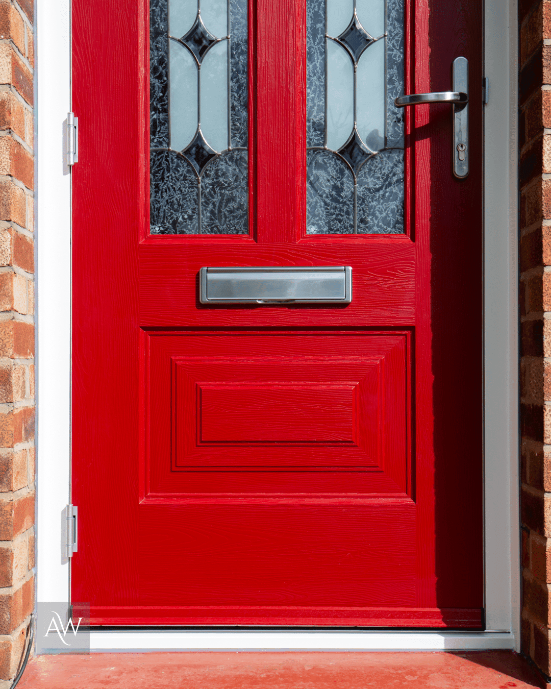 rockdoor composite door in ruby red with a white frame and kudos glass installed at a detached property in Sale by Alexander Windows
