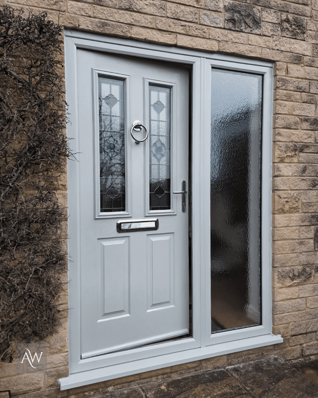 external view of painswick solidor ludlow composite door installed in buxton on a stone property (left view)