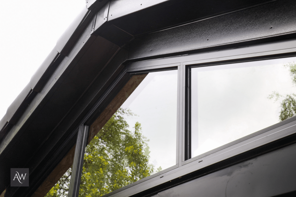 black double glazed gable end back aluminium window installed by alexander windows (above a bifolding door)