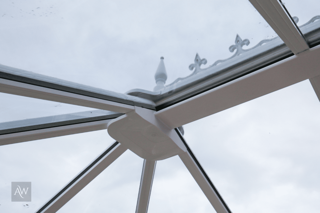 close up of a glass conservatory roof in Cheadle installed by alexander windows - photograph taken from inside.